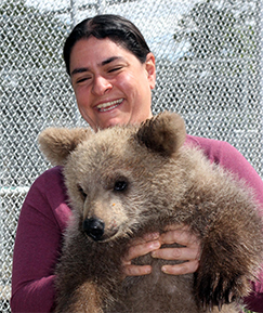 Suzanne Wakim Profile Picture (She ius holding a cute *but scary* cub bear)