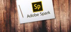 Composit Adobe Spark logo on desk with pencil